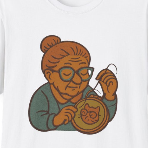 Close-up of the printed design detail: needlepoint grandma, cross-stitching a tiny cat portrait